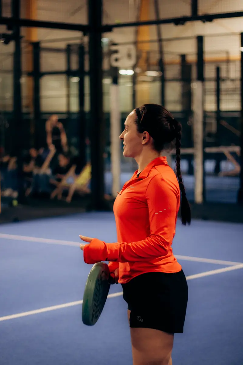 Padel player on an indoor court